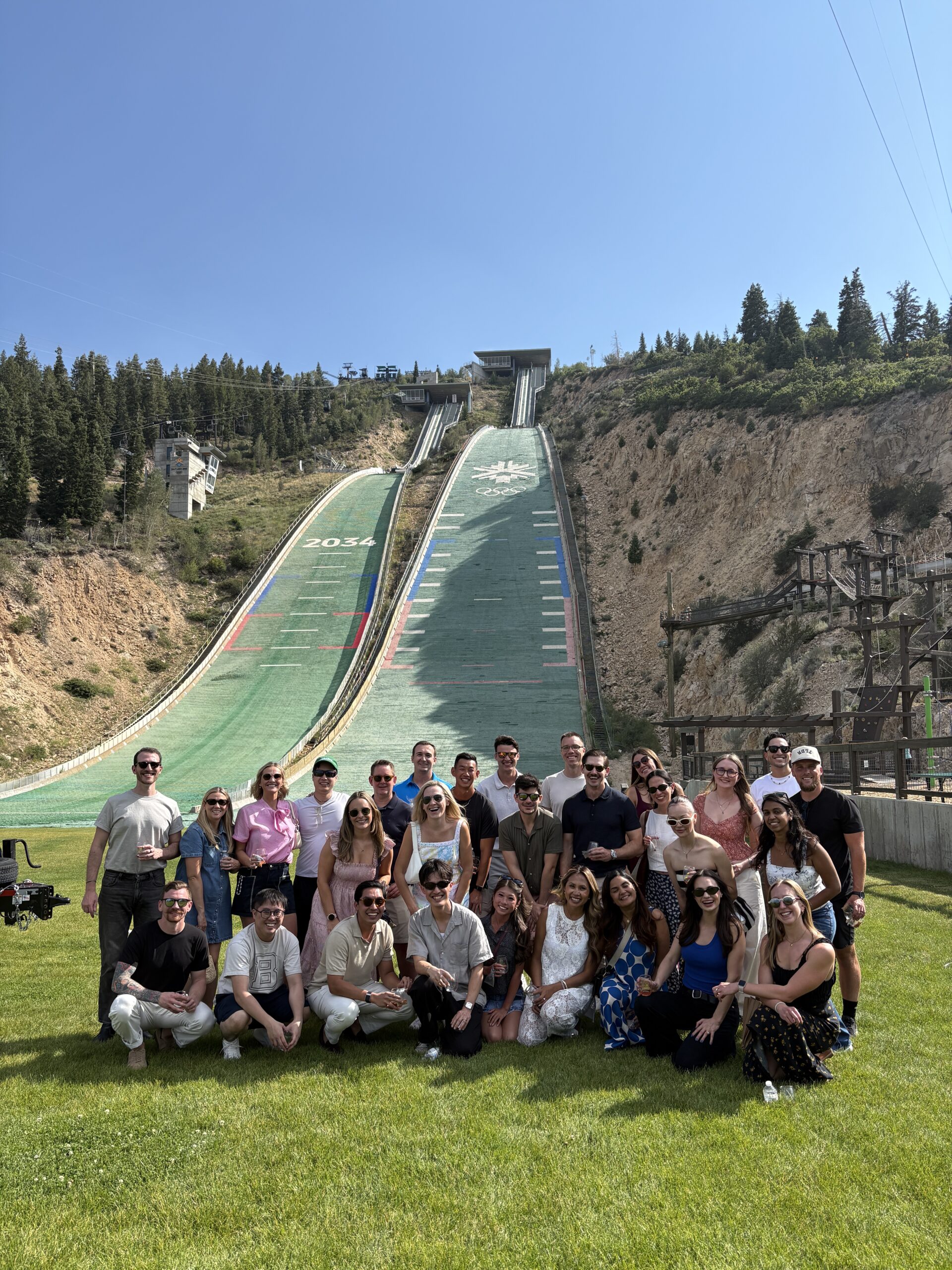 Corporate guests pose at the K120 Olympic ski jump